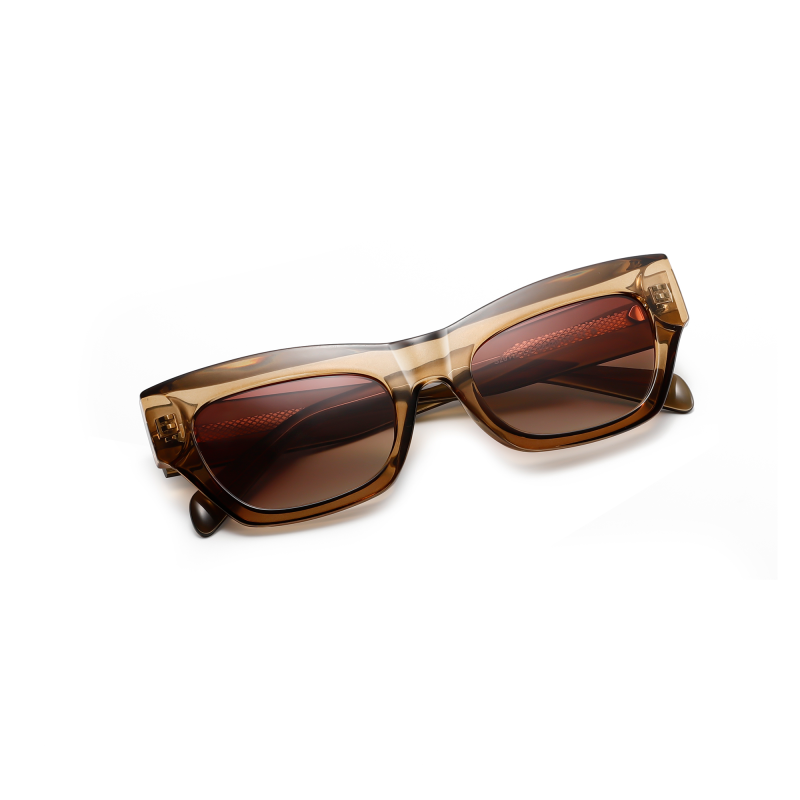 Brown cat eye sunglasses on white background.
