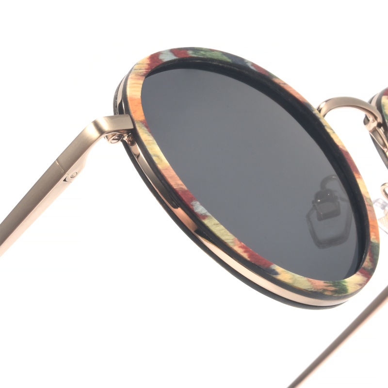 Close-up of stylish round sunglasses with colorful frames.