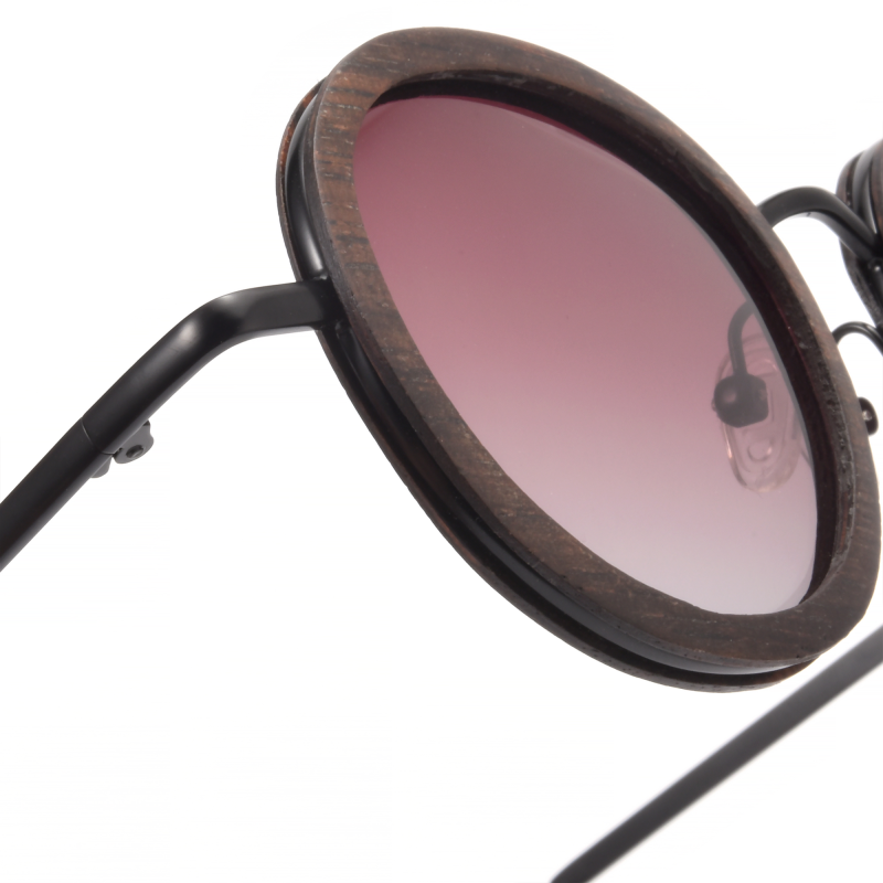 Round sunglasses with gradient lenses and wooden frame.