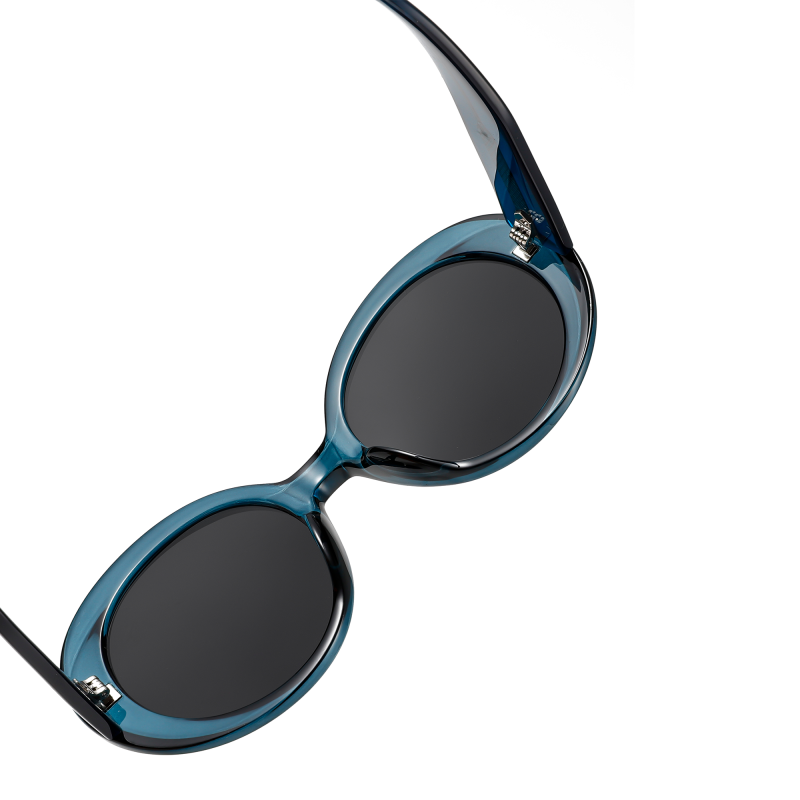 Stylish blue oval sunglasses with black lenses.