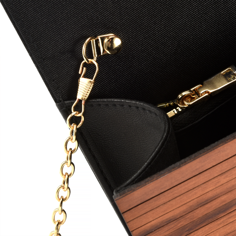 Black purse with gold chain and clasp