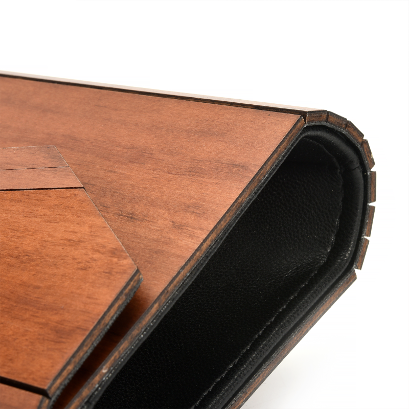 Wooden and leather laptop stand corner detail.