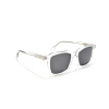 Clear-frame sunglasses with dark lenses.