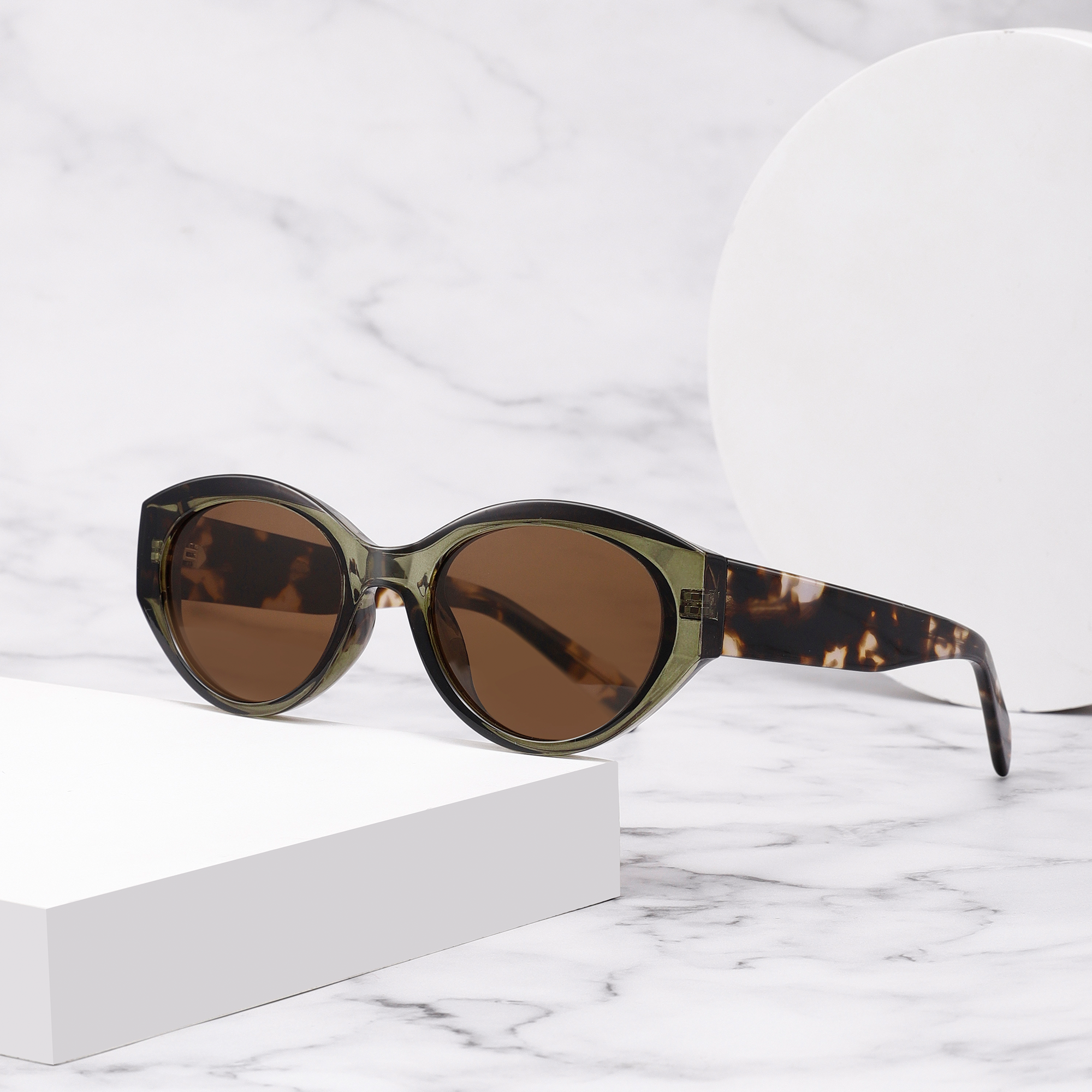 Langham by find unusual side view background Stylish sunglasses with tortoiseshell frame on marble surface.