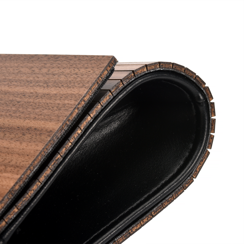 Bentwood curve detail on modern furniture piece.