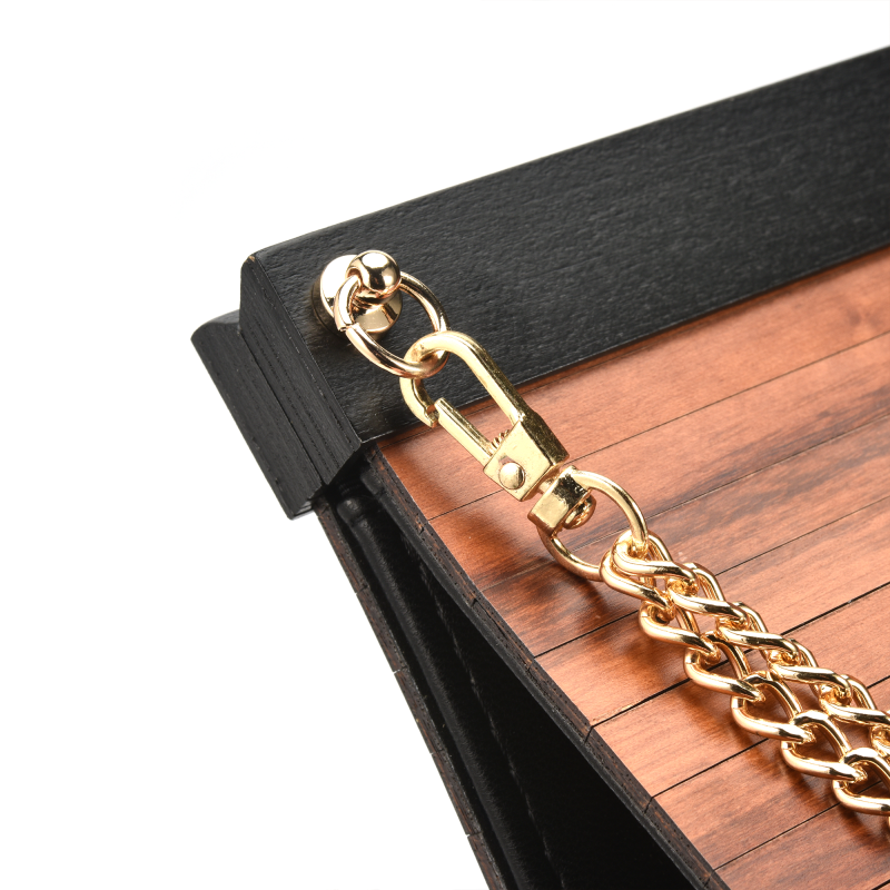 Wooden clutch with gold chain detail