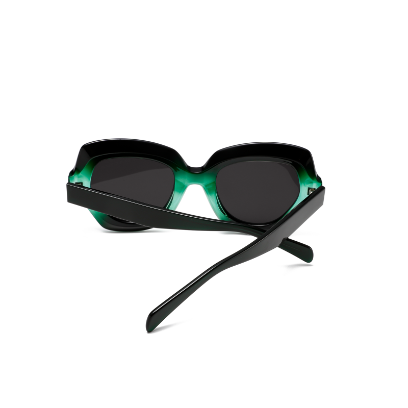 Stylish green and black sunglasses on white background.