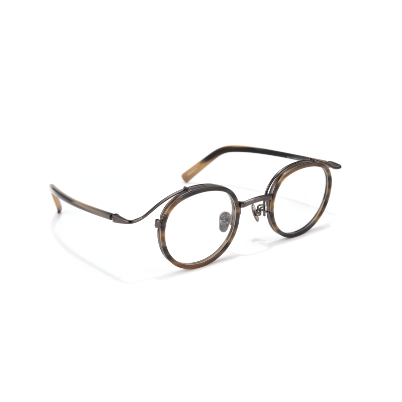 Round tortoiseshell eyeglasses on white background.