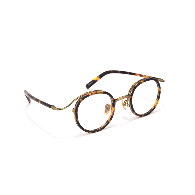 Round tortoiseshell eyeglasses with gold details.