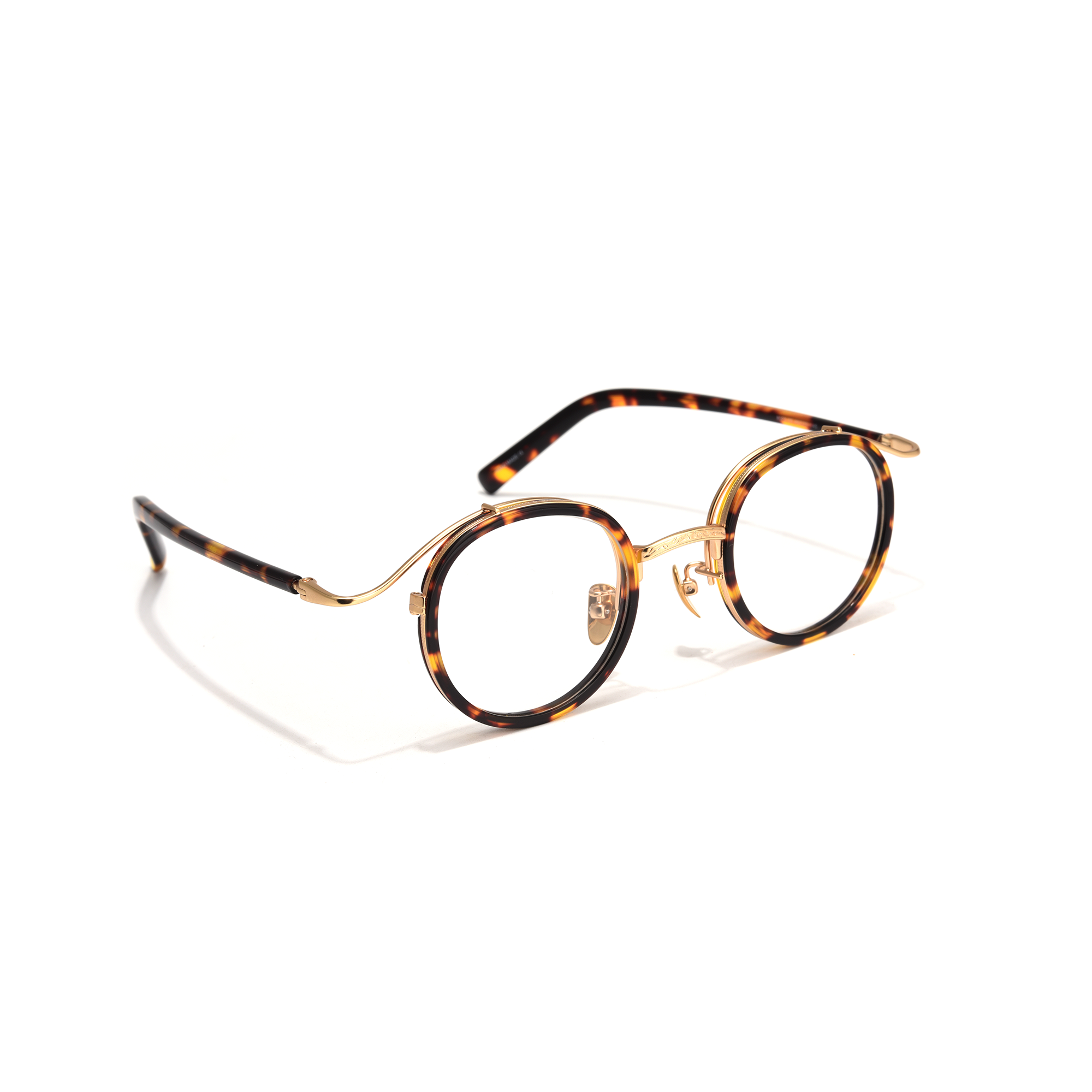 Cottesmore tortoiseshell gold side view Round tortoiseshell eyeglasses on white background