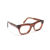 Brown cat-eye glasses with clear lenses on display.