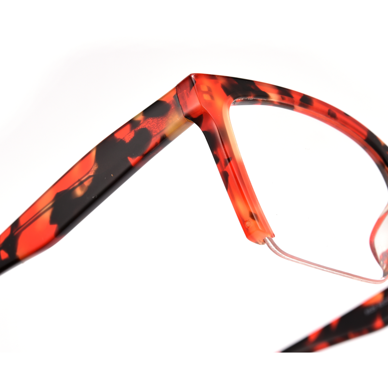Red tortoiseshell eyeglass frames close-up