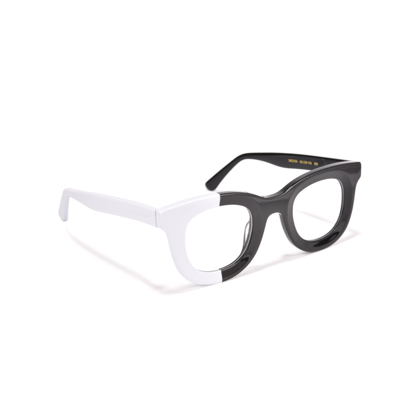 Black and white two-tone eyeglasses on white background.