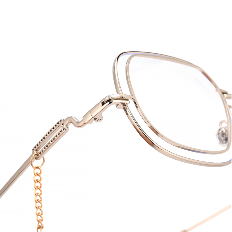 Close-up of gold eyeglasses with decorative chain